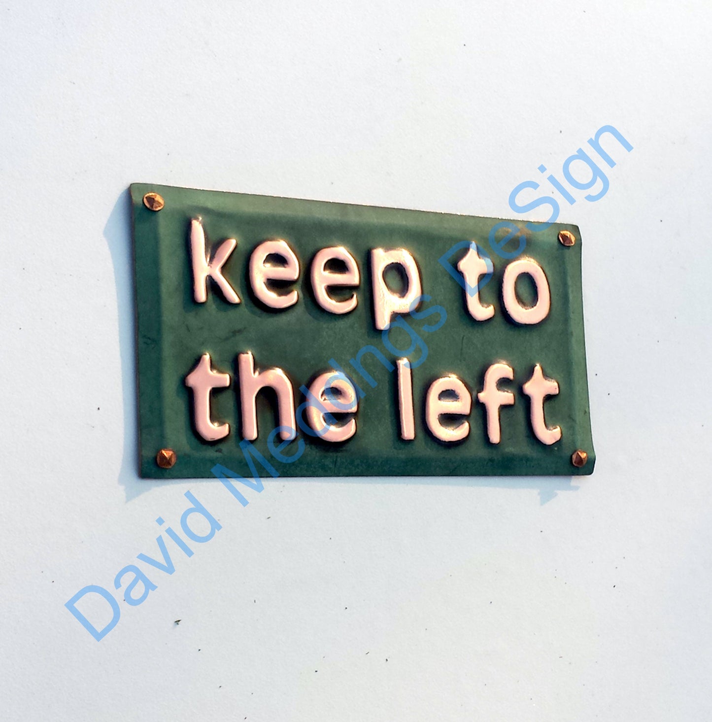 Keep to the left copper plaque