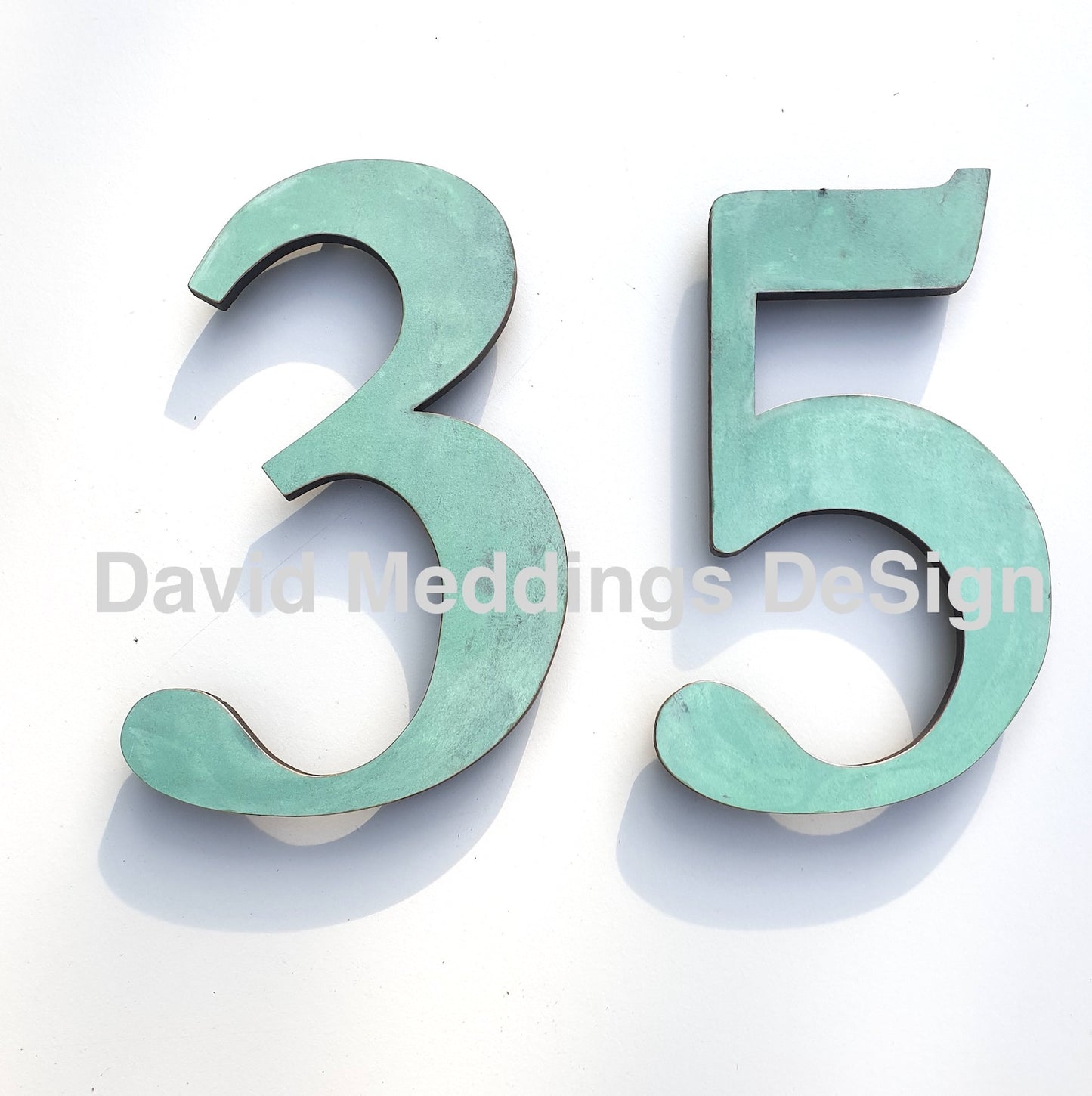 Copper floating number serif patinated
