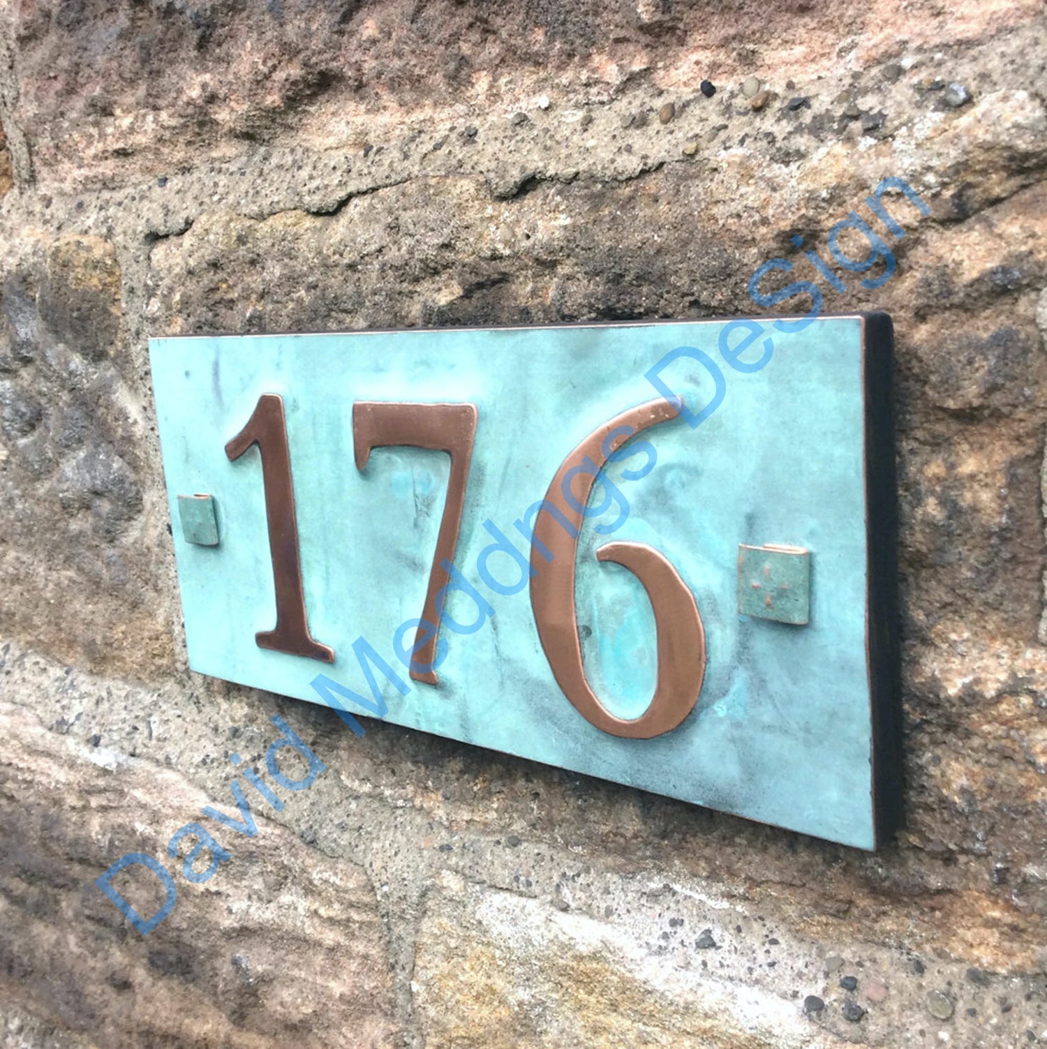 Copper number plaque on plywood