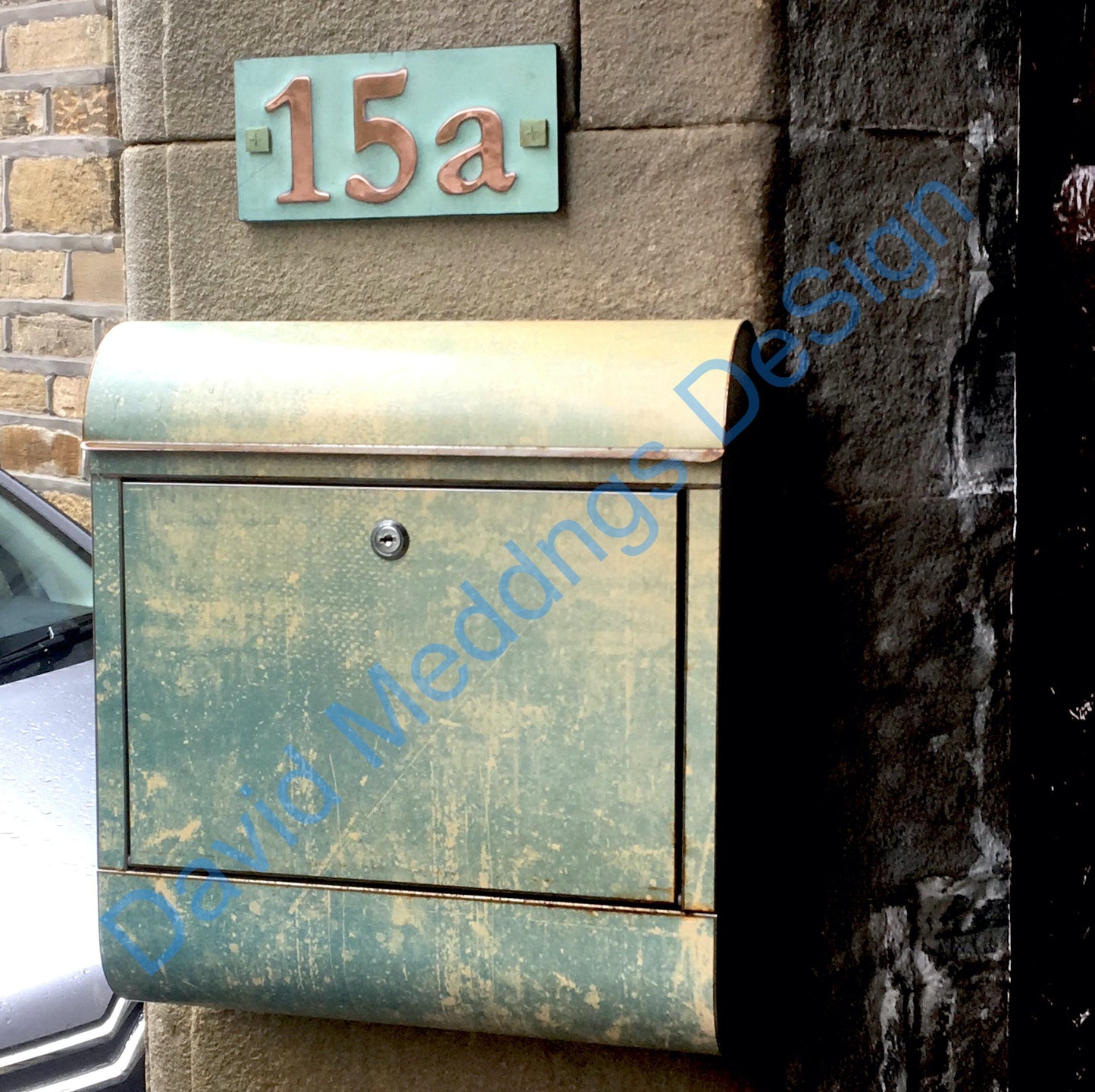 Traditional copper plaque with mailbox