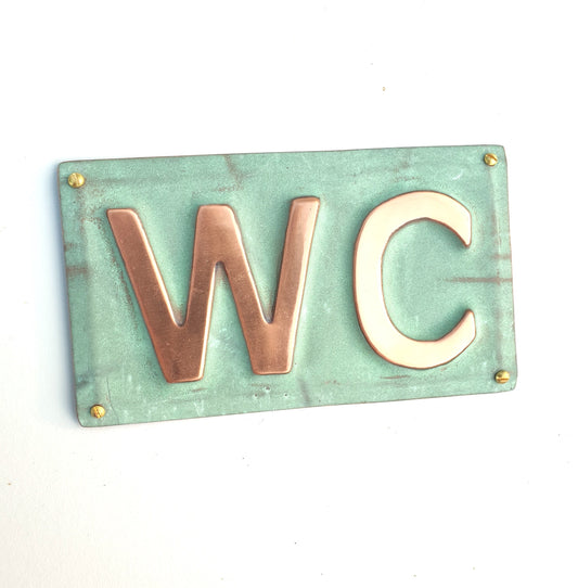 Copper door plaque WC toilet lavatory sign in 2"/50mm high Antigoni in patinated or hammered finish tx